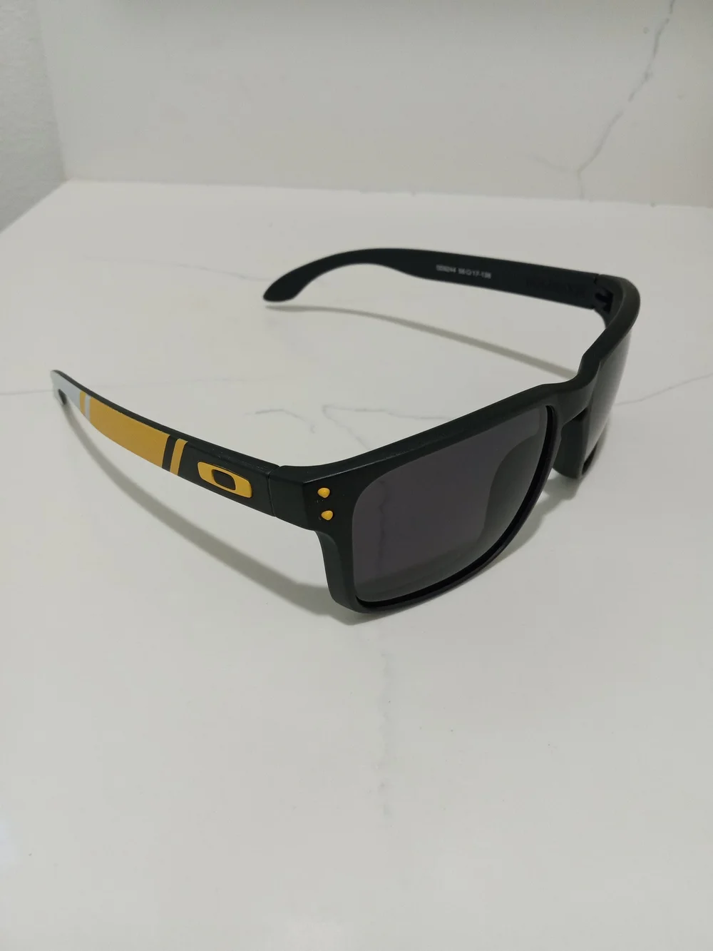 Oakley Black Sunglasses with Gold Temple Accents